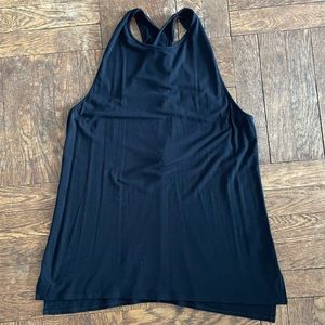 Theory classic long sleeveless roomy tank with cross-cross back.